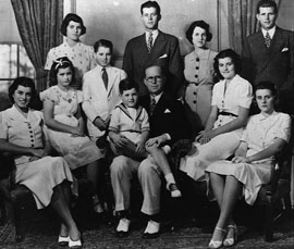 The Kennedy clan gather for a 1938 family photo at Hyannis Port, Mass. Seated from left are Eunice, Jean, Edward on the lap of his father, Joseph P. Kennedy Sr., Patricia and Kathleen. Standing from left are Rosemary, Robert, John, Rose and Joseph Jr. (Boston Globe).