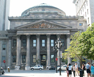 Bank of Montreal's main Montreal branch at Place d'Armes in downtown Montreal. In 1977, BMO's operational headquarters moved to First Canadian Place in downtown Toronto. But its legal head office remains in Montreal.