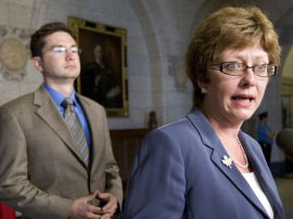 Minister of Human Resources and Skills Development Diane Finley speaks with the media about the EI working group as fellow committee member Pierre Poilievre looks on, September 3. (The Canadian Press). It has subsequently been reported “Tories to introduce own EI reform ... Human Resources Minister says changes to come in fall session; Liberals question why proposals weren't made to the bipartisan working group.”