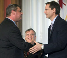 David Caplan sworn in as health minister In this June 2008 photo Ontario Premier Dalton McGuinty shakes hands with David Caplan after he was sworn in as health minister. Lieutenant Governor David Onley looks on. (Adrian Wyld/Canadian Press).