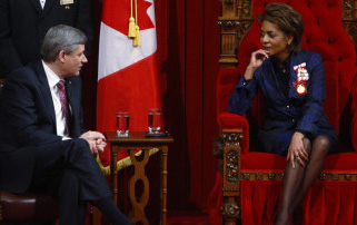 Prime Minister Stephen Harper speaks with Governor-General Michaelle Jean as she waits to deliver the Speech from the Throne in the Senate Chamber on Parliament Hill in Ottawa, Monday Jan.26, 2009. [The Canadian Press].