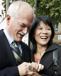 New Democratic Party (NDP) leader Jack Layton and his wife and NDP candidate Olivia Chow show his father's parliamentary pin ring that he wears for good luck after casting their federal election votes in Toronto, October 14, 2008. The late Robert Layton was a Progressive Conservative Member of Parliament in the 1980's. (Reuters). 