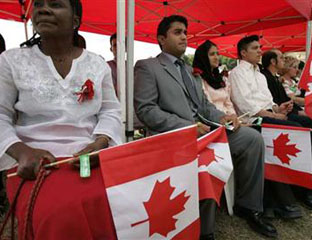 New Canadian citizens at a swearing-in ceremony held at Centennial Park in Etobicoke, Ontario, July 1, 2005 – before the present Conservative minority government came to office.  