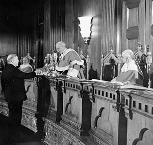 Chief Justice Thibaudeau Rinfret presenting a citizenship certificate to the Rt. Hon. W.L. Mackenzie King, Prime Minister of Canada, during the first citizenship ceremony to take place following the enactment of the first Canadian Citizenship Act in 1947. Before this Act Canadians had just been “British subjects.” 