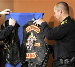 Police hang a Bandidos vest up at a press conference at Ontario Provincial Police Headquarters in Elgin County, April 10, 2006.