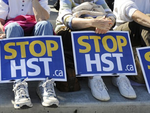 Anti-HST signs at a rally in Vancouver this past September. Photograph by: Arlen Redekop, Canwest News Service.