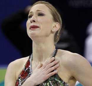 Canada's (and Quebec’s) Joannie Rochette cries after finishing her routine in the women's short programme figure skating event at the Vancouver 2010 Winter Olympics February 23, 2010. Rochette's mother died just days before the start of the women's Olympic figure skating competition. Photograph by: REUTERS/Andy Clark, National Post.