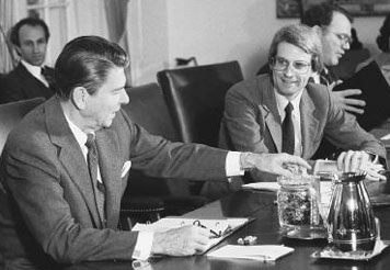 President Ronald Reagan (left) offers youthful budget director David Stockman some jelly beans during a budget meeting in the 1980s. Â© Bettmann/Corbis.