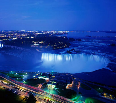 Niagara Falls, Ontario at night – right next door to Niagara Falls, New York. Once upon a time New York was the most populous state of the union. Then California surged ahead, and now even Texas has more people. But it will still be quite a long time before any other Canadian province has more people than Ontario – as Dalton McGuinty keeps trying to remind the rest of Canada.