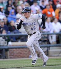 Travis Snider runs home to score the game-winning run during the ninth inning in Baltimore, Friday, April 9, 2010. THE ASSOCIATED PRESS/Nick Wass.