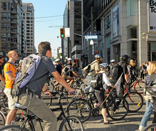 Cyclists at a Darcy Sheppard memorial shortly after his death, Bloor Street in Toronto.