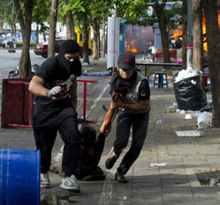 Anti-government supporters rescue a fellow Red Shirt who was shot after Thai army soldiers stormed barricades where thousands of protesters were encamped in Bangkok on May 19. ADREES LATIF/REUTERS Reuters. 