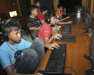 Indonesian youths browse the Internet at an Internet cafe in Jakarta, June 12, 2010. Many Indonesians don't want them watching sex videos, of anyone.