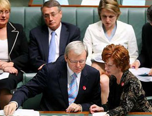 Julia Gillard and the man she finally replaced as prime minister, Kevin Rudd, confer in Australian House of Representatives in an earlier era.